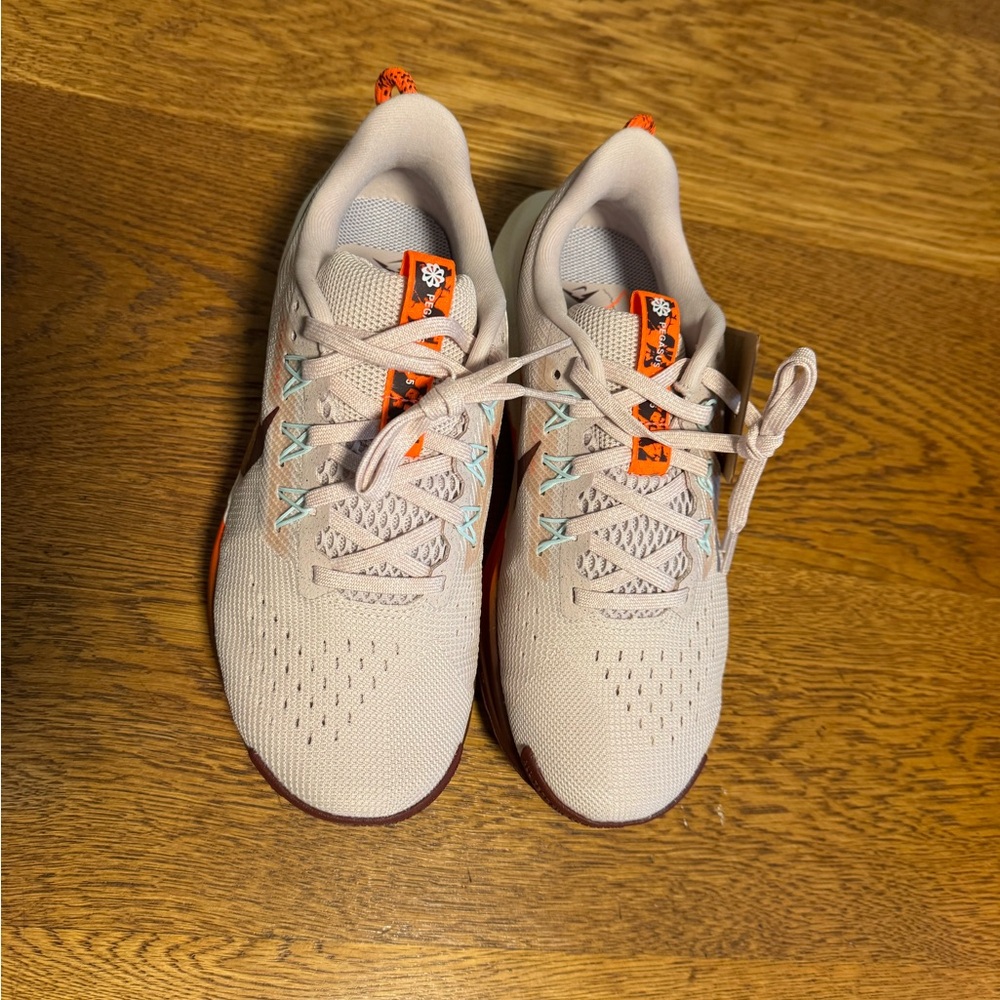 Nike womens Pale Pink Sneakers with Orange Pull Tabs